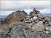 The summit cairn on Beinn Tulaichean with Cruach Ardrain in the background