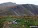 The small pile of stones on the summit of Gwaun y Llwyni with Aran Fawddwy (left) and Drysgol (right) beyond