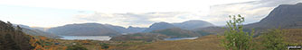 Panoroama featuring Glas Bheinn (Ben More Assynt) and the shoulder of Spidean Coinich (Quinag) from the Assynt viewpoint on the A838 (North Coast NC500 route) at Bealach Strome