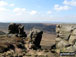 Rock formations on the northern edge of Kinder Scout with Featherbed Moss over Black Ashop Moor in the background.