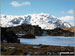 Snow on Scafell Pike from a frozen Innominate Tarn