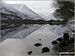 The lower slopes of Hartsop Dodd (left), Caudale Head, The Kirkstone Pass and High Hartsop Dodd (right, behind the tree) reflected in Brothers Water in the snow