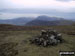 Gavel Fell summit cairn with Mellbreak and Grasmoor beyond