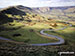 The road winding its way down to Edale from Mam Tor with Lord's Seat (Rushup Edge) (left) and Kinder Scout in the distance