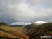 Helvellyn (centre left) and Seat Sandal (right) above The Pass of Dunmail Raise from Helm Crag