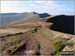 Me striding out across Craig Cwmoergwm with Corn Du (centre - distance), Pen y Fan, Cribyn amd Fan y Big (far right).