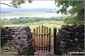 Handgate on Arnside Knott with Kent Viaduct (railway bridge) across Morecambe Bay in the distance