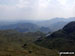 The view from Sergeant Man featuring Blea Rigg (centre left),Lingmoor Fell (distance centre), Stickle Tarn (partially hidden) and the shoulder of Pavey Ark (The Langdale Pikes) (right)