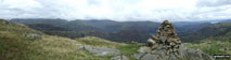 Steel Fell, Gibson Knott and Helm Crag below Seat Sandal (with Helvellyn and Fairfield in mist beyond) from Tarn Crag summit cairn