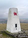 Moel Penderyn Summit Trig Point emblazoned with a Welsh Dragon